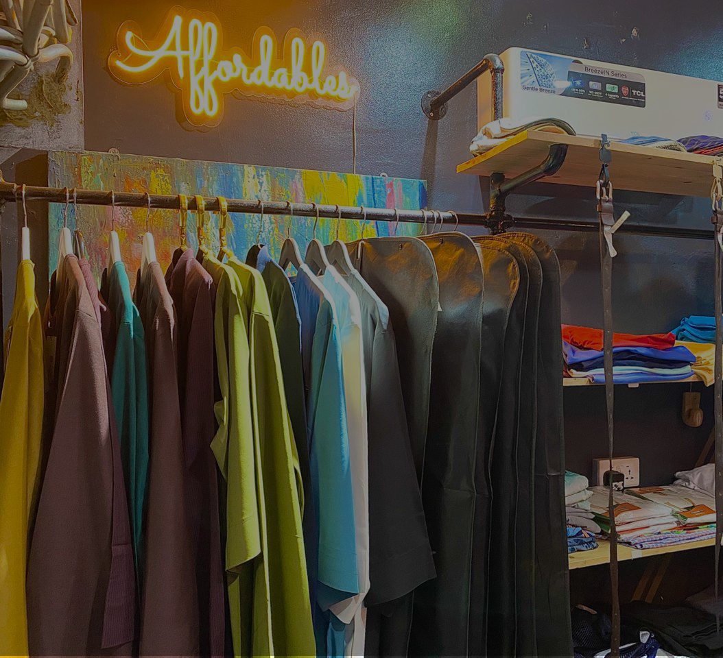 A rail of suits and jackets inside the DHP Fashion store